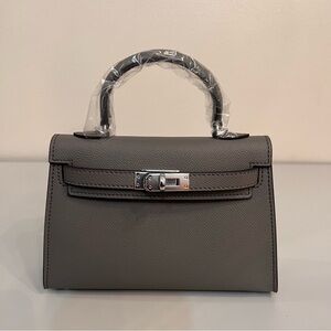 Genuine Epsom Leather mini handbag with shoulder strap featuring Silver hardware